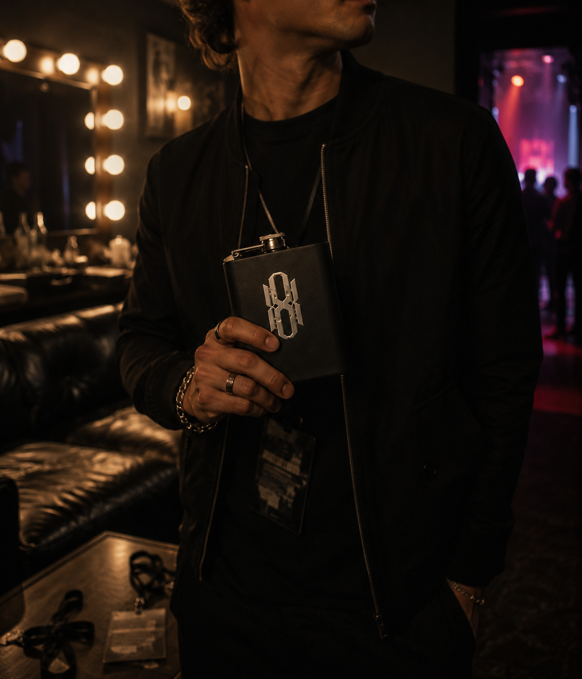 Man holding the Canteen Noir backstage at a nightclub